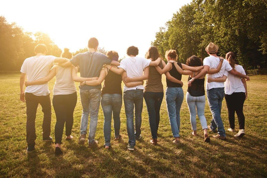 Community-Involvement-Group-of-Friends-Embracing-After-a-Long-Day-of-Community-Service